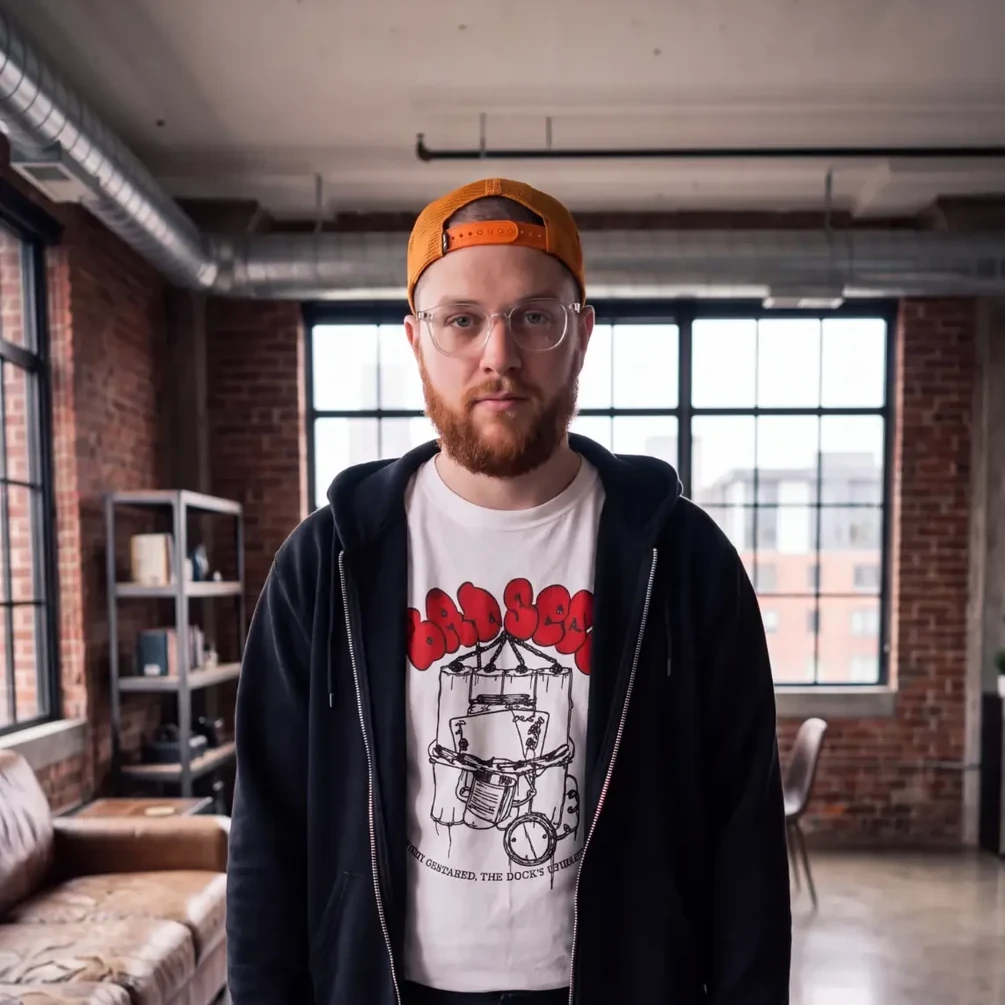 Chest-up portrait of Joshua Olencki in an industrial studio
